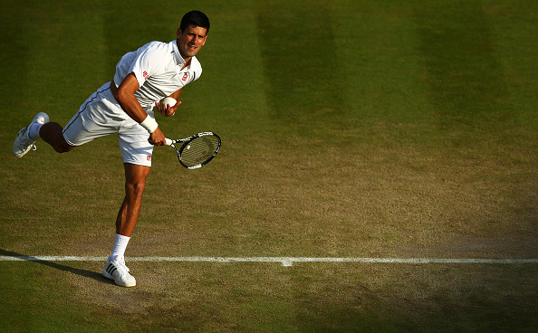 LONDON, ENGLAND - JULY 06:  Novak Djokovic of Serbia serves in his Gentlemen's Singles Fourth Round match against Kevin Anderson of South Africa during day seven of the Wimbledon Lawn Tennis Championships at the All England Lawn Tennis and Croquet Club on July 6, 2015 in London, England.  (Photo by Clive Brunskill/Getty Images)