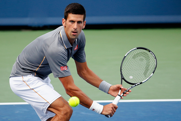 CINCINNATI, OH - AUGUST 19:  Novak Djokovic of Serbia returns a shot to Benoit Paire of France during the Western & Southern Open at the Linder Family Tennis Center on August 19, 2015 in Cincinnati, Ohio.  (Photo by Rob Carr/Getty Images)