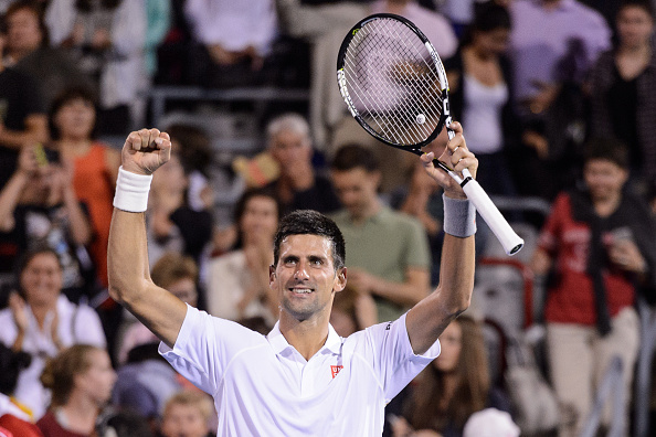 MONTREAL, ON - AUGUST 14:  Novak Djokovic of Serbia celebrates his victory against Ernests Gulbis of Latvia during day five of the Rogers Cup at Uniprix Stadium on August 14, 2015 in Montreal, Quebec, Canada.  Novak Djokovic defeated Ernests Gulbis 5-7, 7-6, 6-1.  (Photo by Minas Panagiotakis/Getty Images)